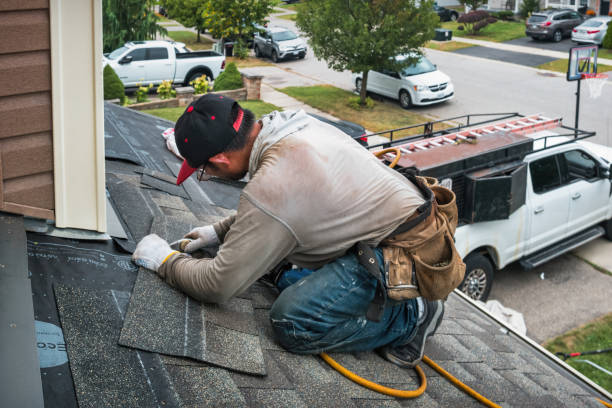 Professional Roofing technician working in Earlham, IA